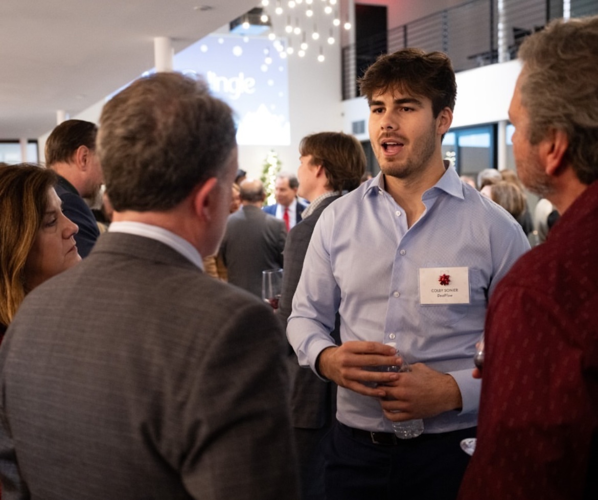 Speaking with attendees at a pitch event (local hardware/AI community)
